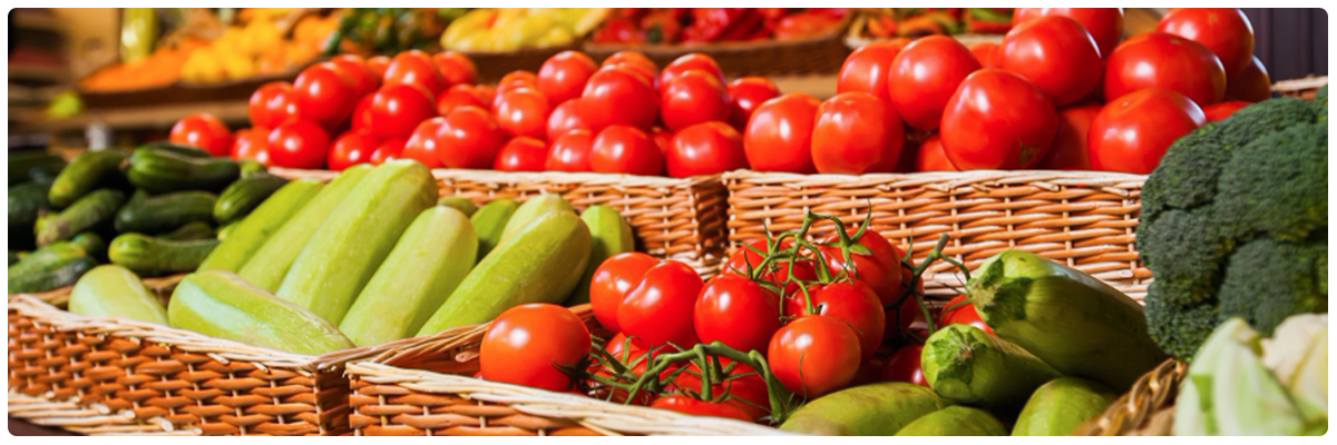 Different vegetables including tomatoes in baskets