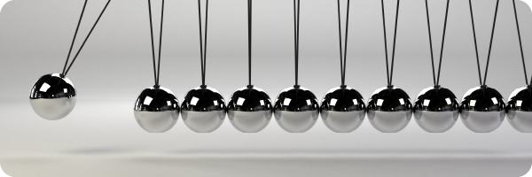 a Newton's cradle to represent cause and effect of IBS