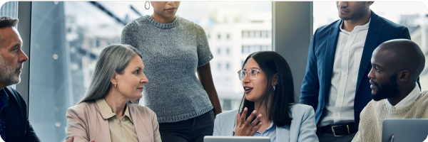 People of different genders and ethnicities and ages in a business office setting to represent that most of us could potentially benefit from slower breathing through the nose.  