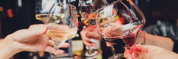 People celebrate and clinking glasses of various alcoholic drinks.