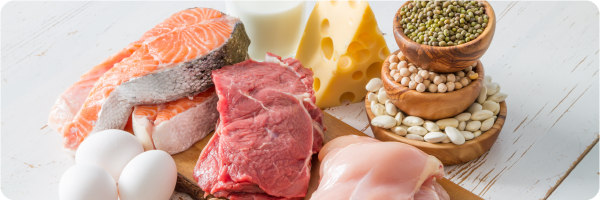 Eat enough protein sleep tip. Image shows salmon, cheese, eggs, chicken, red meat and beans and seeds as food sources of protein.