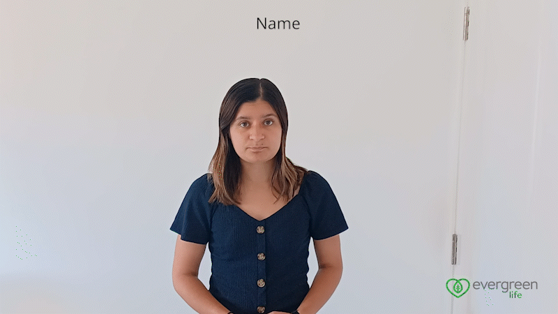 A GIF of Evergreen Life Content Writer Jayna Shepherd signing the words' What's your name?' in British Sign Language.